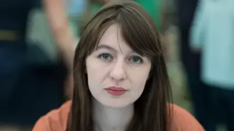 Irish author Sally Rooney claims she is unable to travel to the UK due to arrest fears